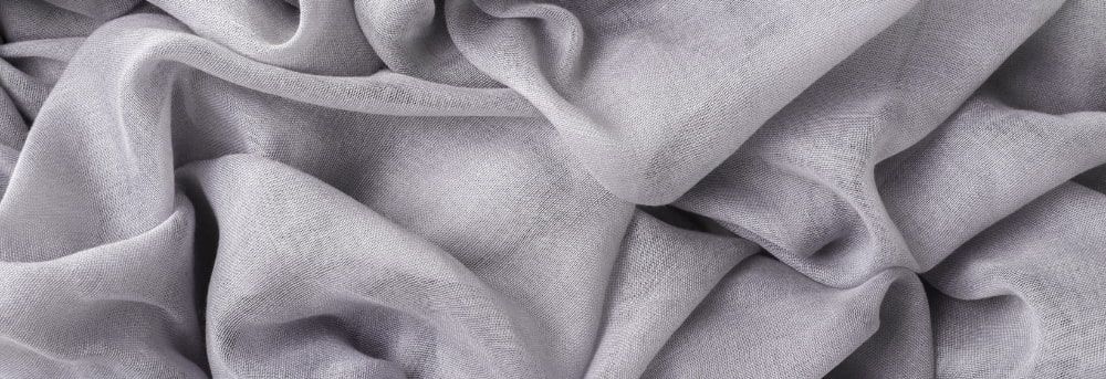 Tissu broderie en lin gris